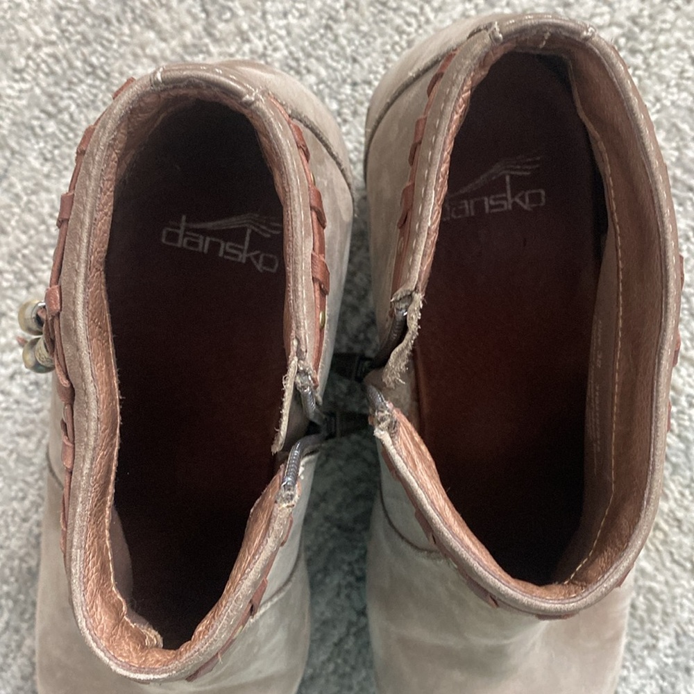 Gently used Dansko bootie size 38 suede taupe with tan tassels.